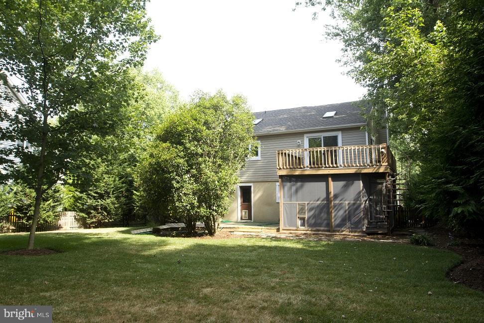 680 Red Cedar Road Annapolis, MD 21409 - Photo 22 of 30 a view of a house with a yard and a tree