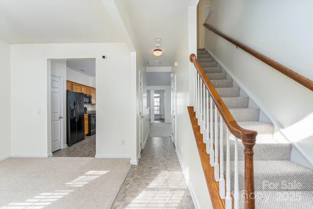a view of a hallway view with staircase