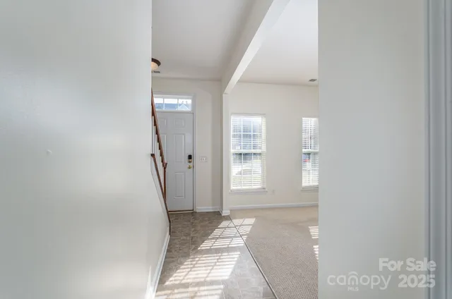 a view of a hallway with windows