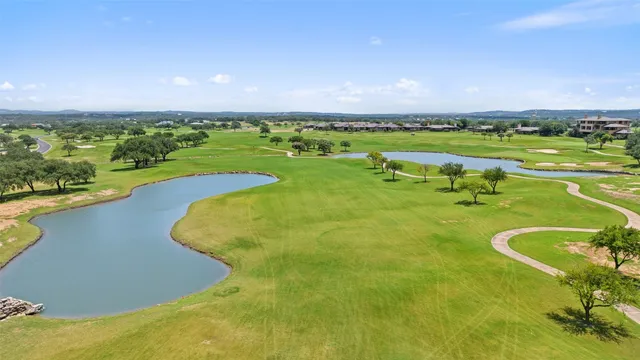 an aerial view of a golf course with a big yard