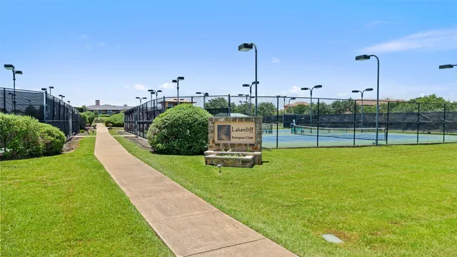 a view of a lake with houses in the back