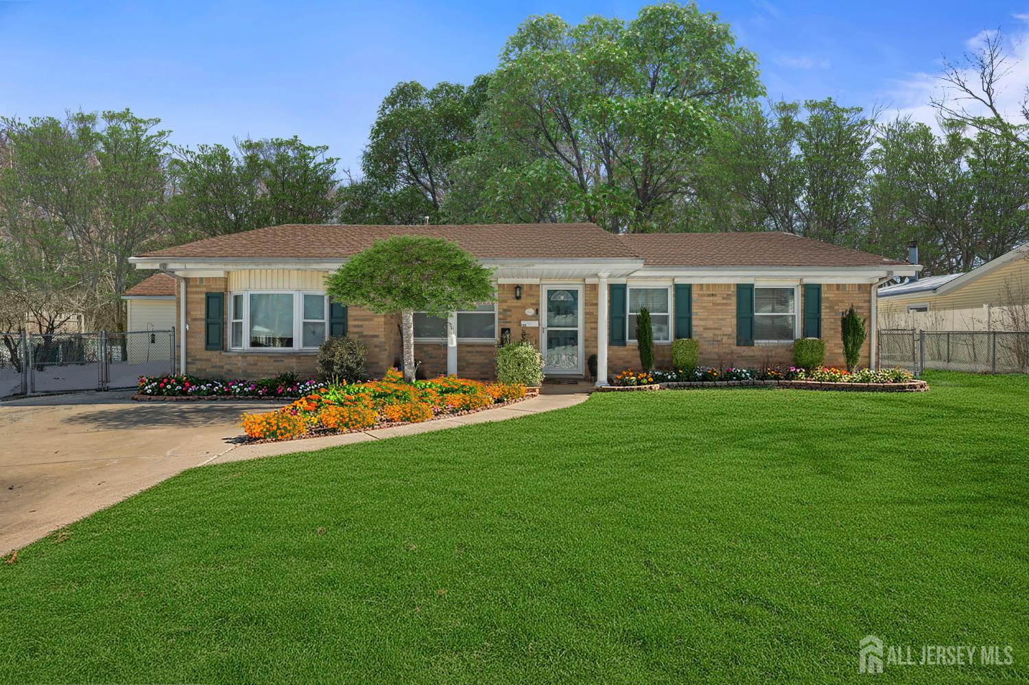 a swimming pool view with a seating space and a garden view