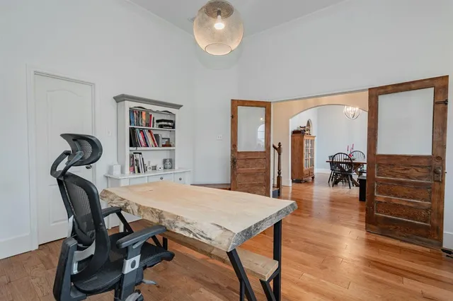 a view of a dining room with furniture and wooden floor