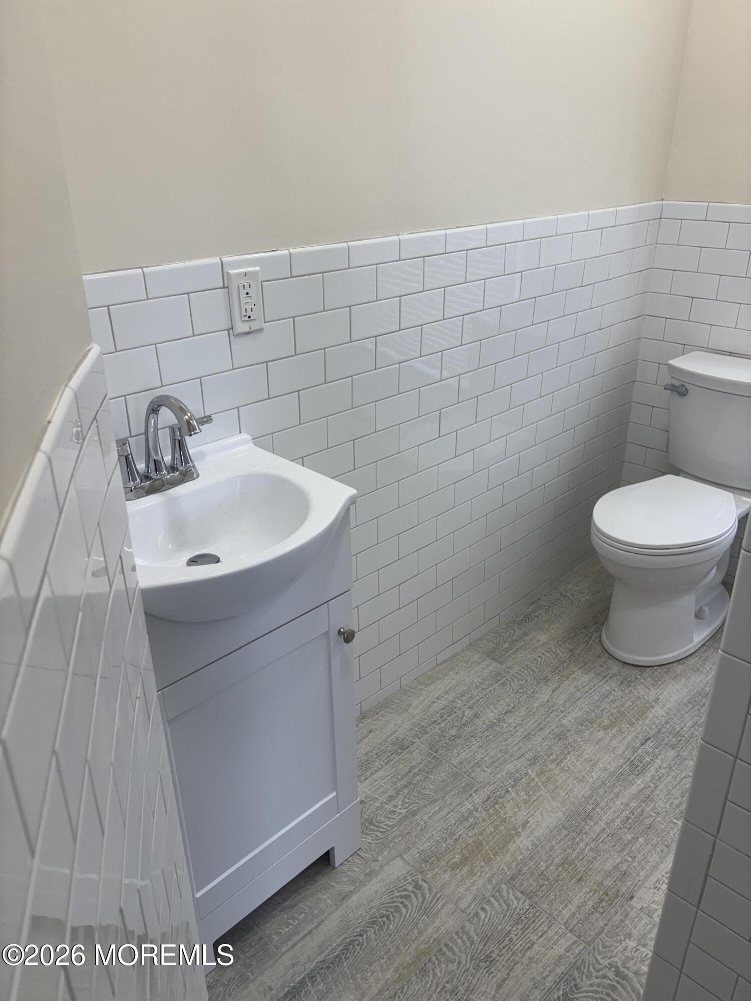 178 Broad Street, Unit D Keyport, NJ 07735 - Photo 4 of 7 a bathroom with a sink and a toilet