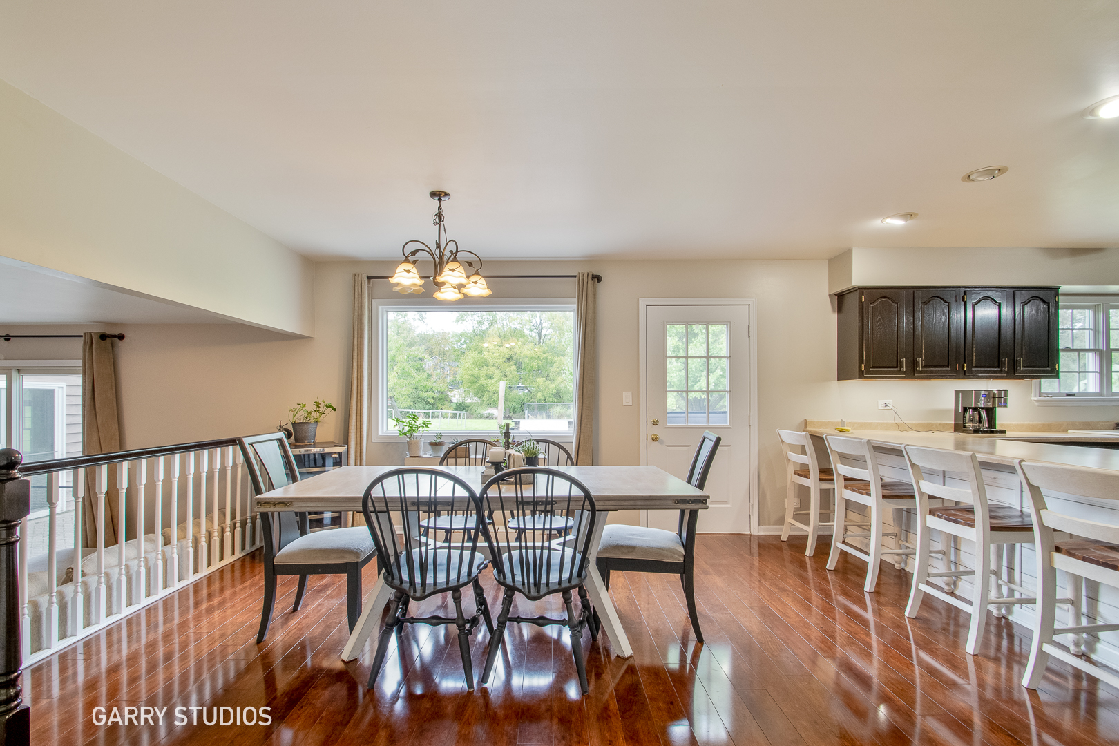 28824 Rivers Edge Drive Cary, IL 60013 - Photo 12 of 39 a view of a dining room with furniture window and wooden floor