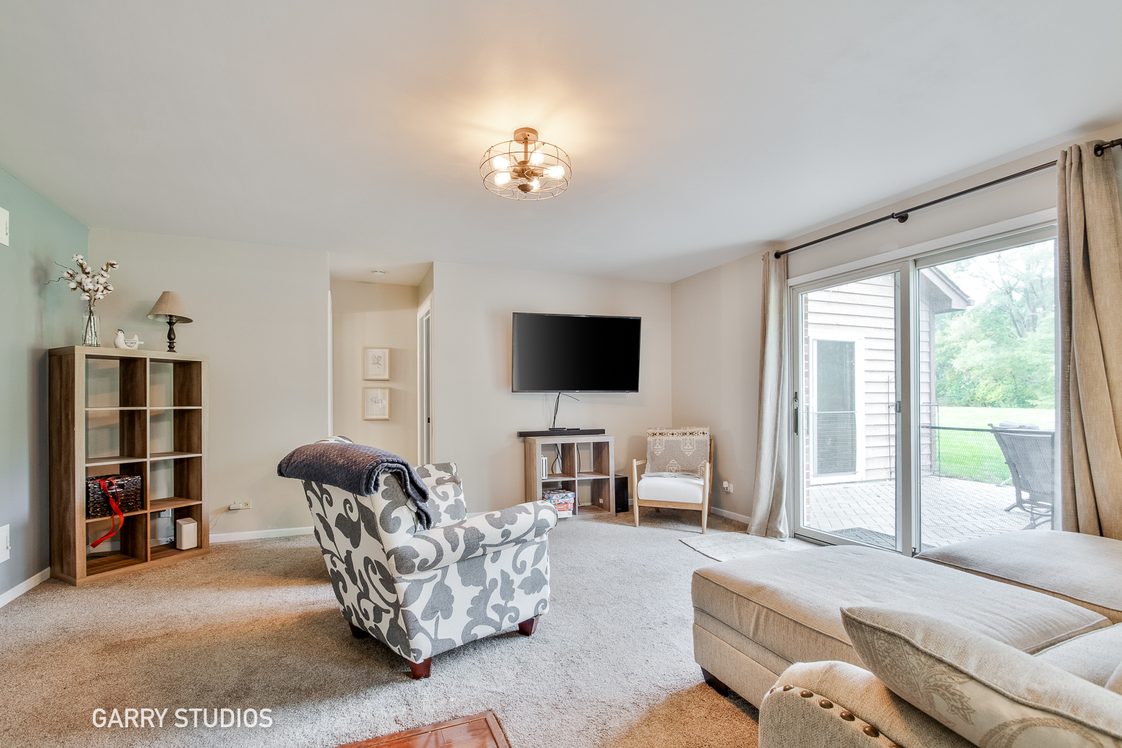 28824 Rivers Edge Drive Cary, IL 60013 - Photo 14 of 39 a living room with furniture and a flat screen tv