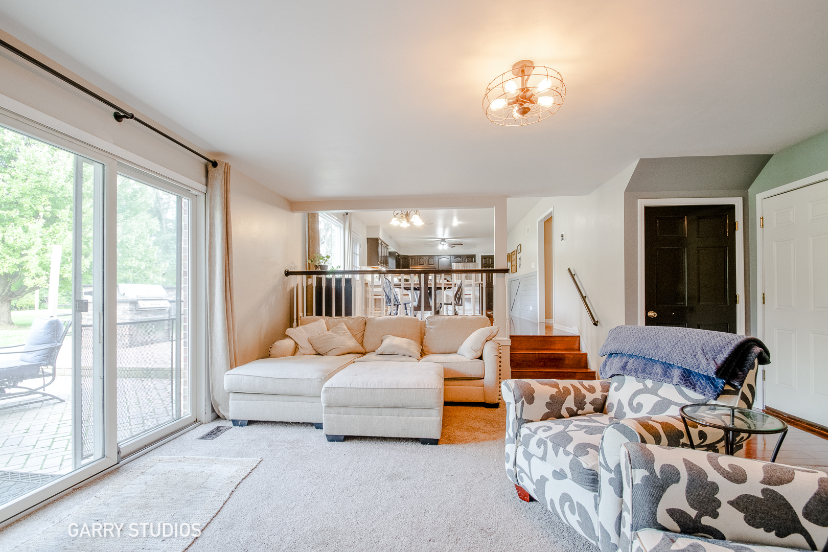 28824 Rivers Edge Drive Cary, IL 60013 - Photo 15 of 39 a living room with furniture and a large window
