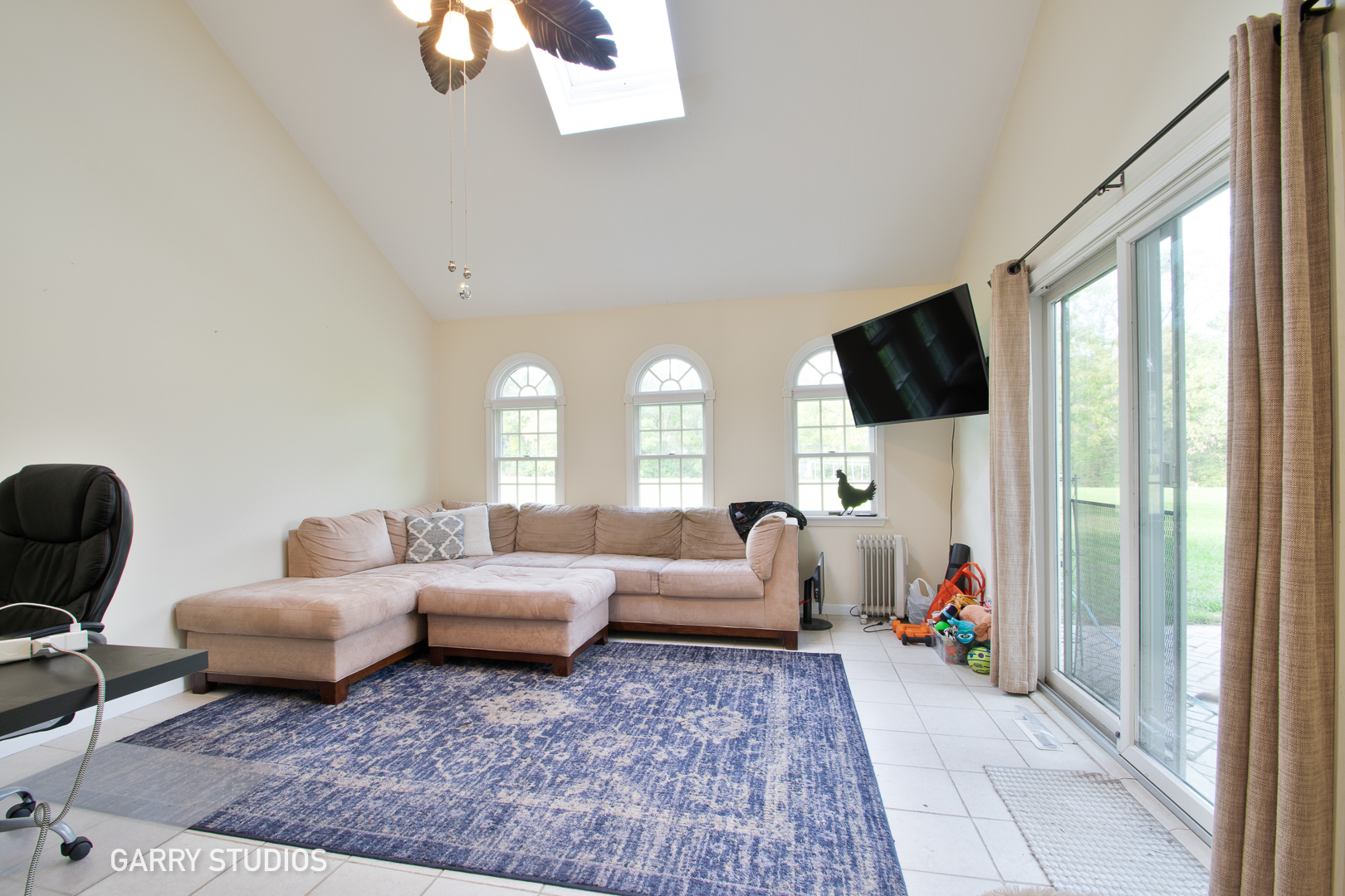 28824 Rivers Edge Drive Cary, IL 60013 - Photo 18 of 39 a living room with furniture and a flat screen tv
