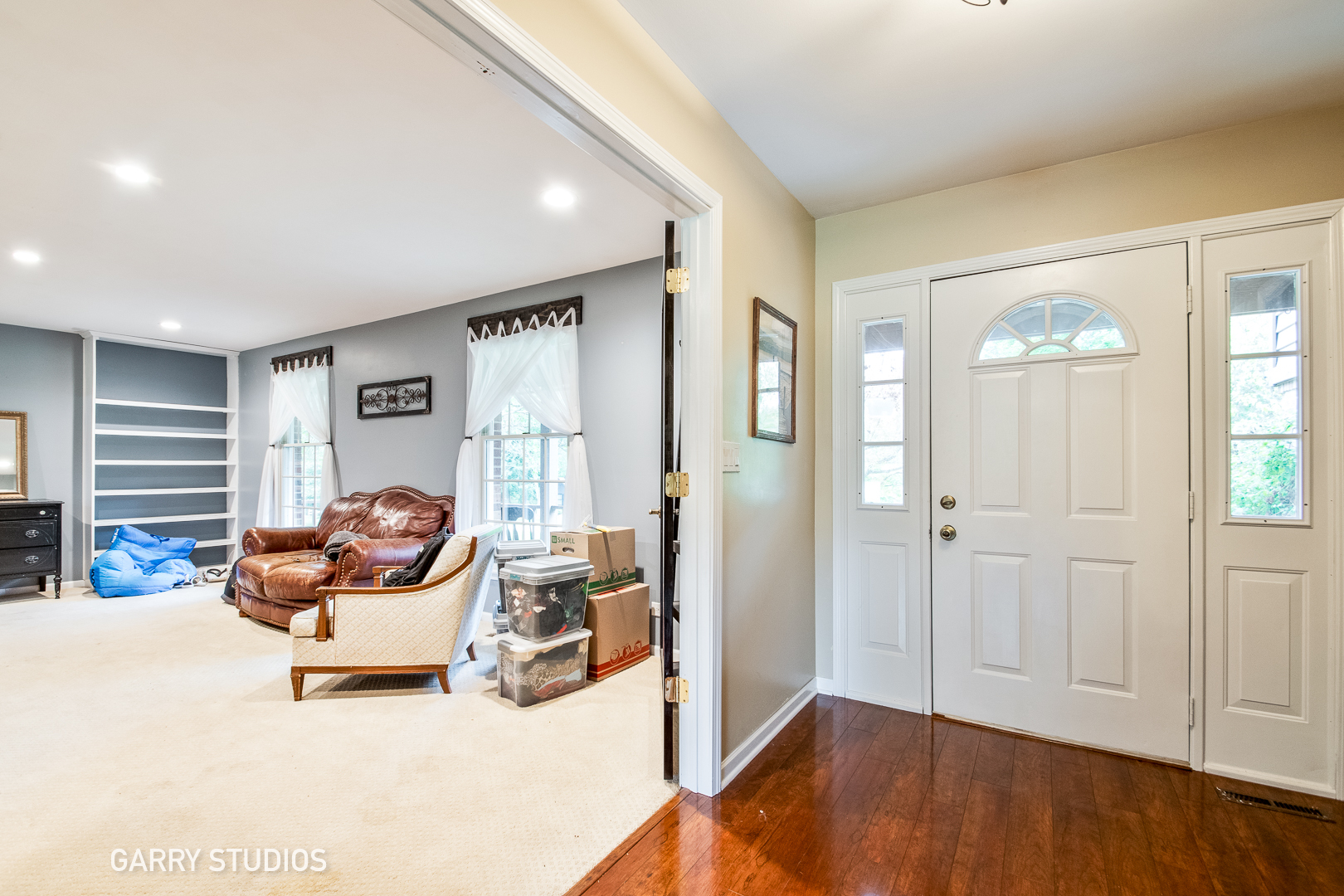 28824 Rivers Edge Drive Cary, IL 60013 - Photo 2 of 39 a living room with furniture and a wooden floor
