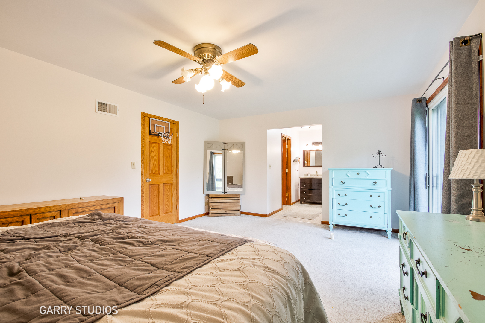 28824 Rivers Edge Drive Cary, IL 60013 - Photo 21 of 39 a bedroom with a bed and a chandelier