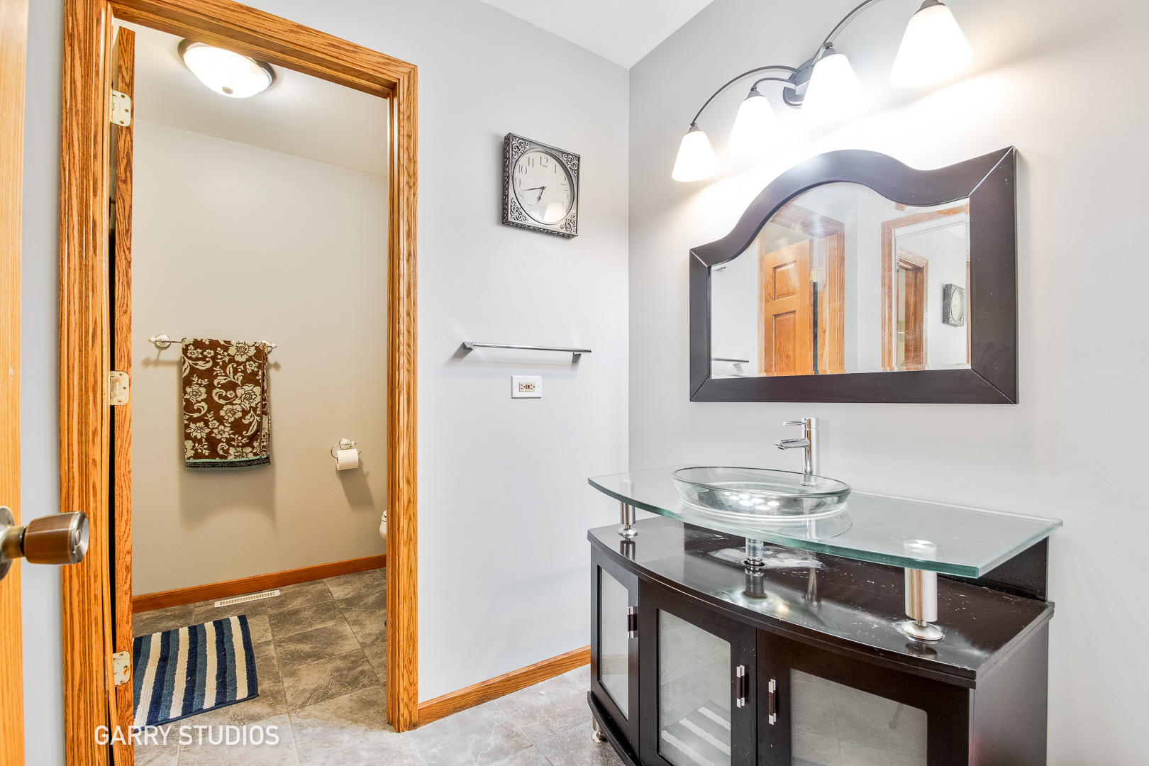 28824 Rivers Edge Drive Cary, IL 60013 - Photo 27 of 39 a bathroom with a sink and a mirror
