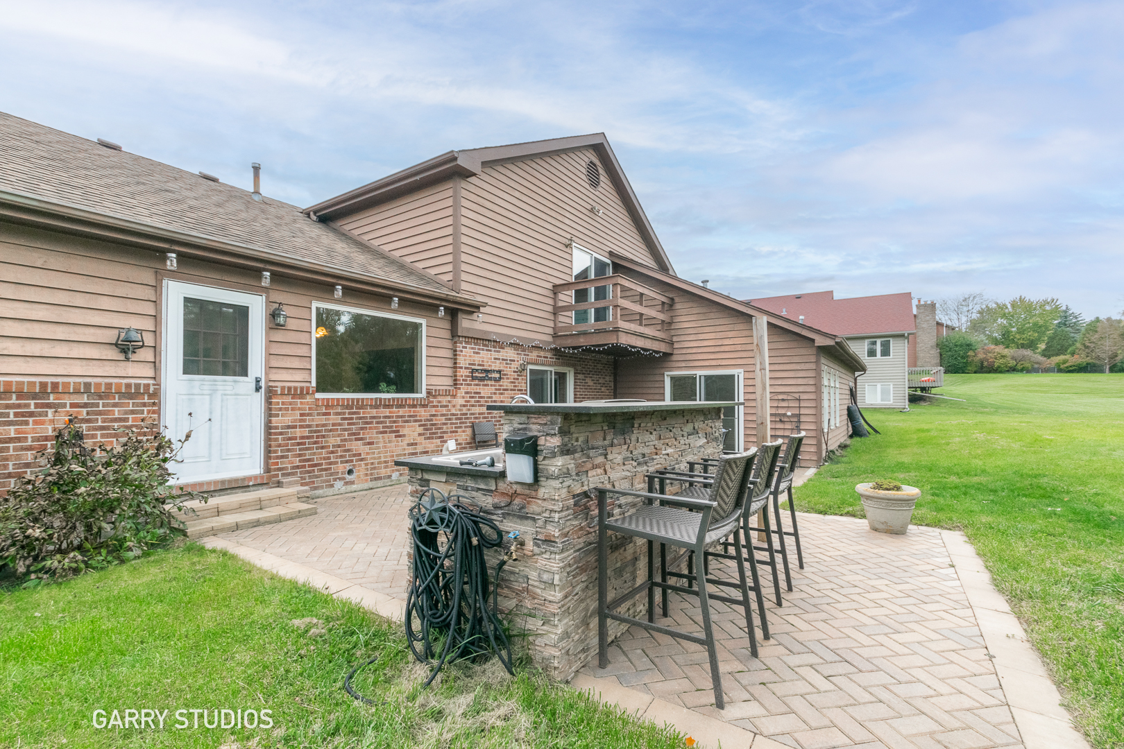 28824 Rivers Edge Drive Cary, IL 60013 - Photo 32 of 39 a front view of house with table and chairs in patio