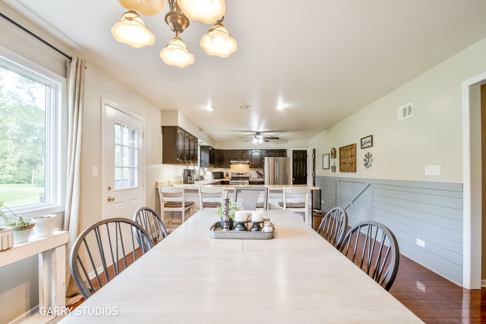 28824 Rivers Edge Drive Cary, IL 60013 - Photo 6 of 39 a view of a dining area with furniture window and wooden floor