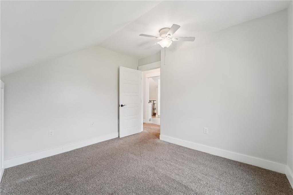 6012 Cunningham Road Gibsonia, PA 15044 - Photo 16 of 26 a view of an empty room and a chandelier fan