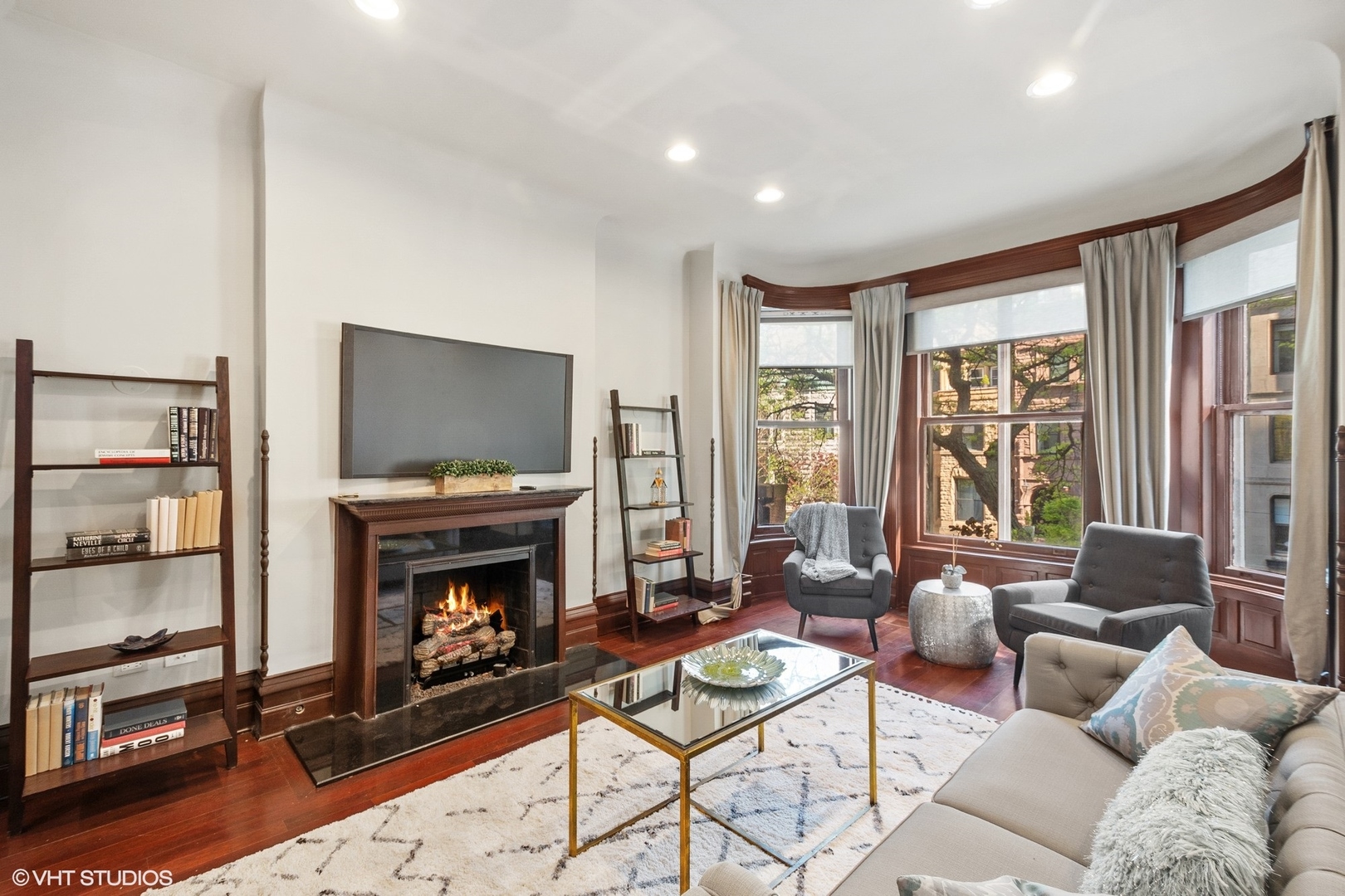67 East Cedar Street Chicago, IL 60611 - Photo 12 of 37 a living room with furniture a flat screen tv and a fireplace