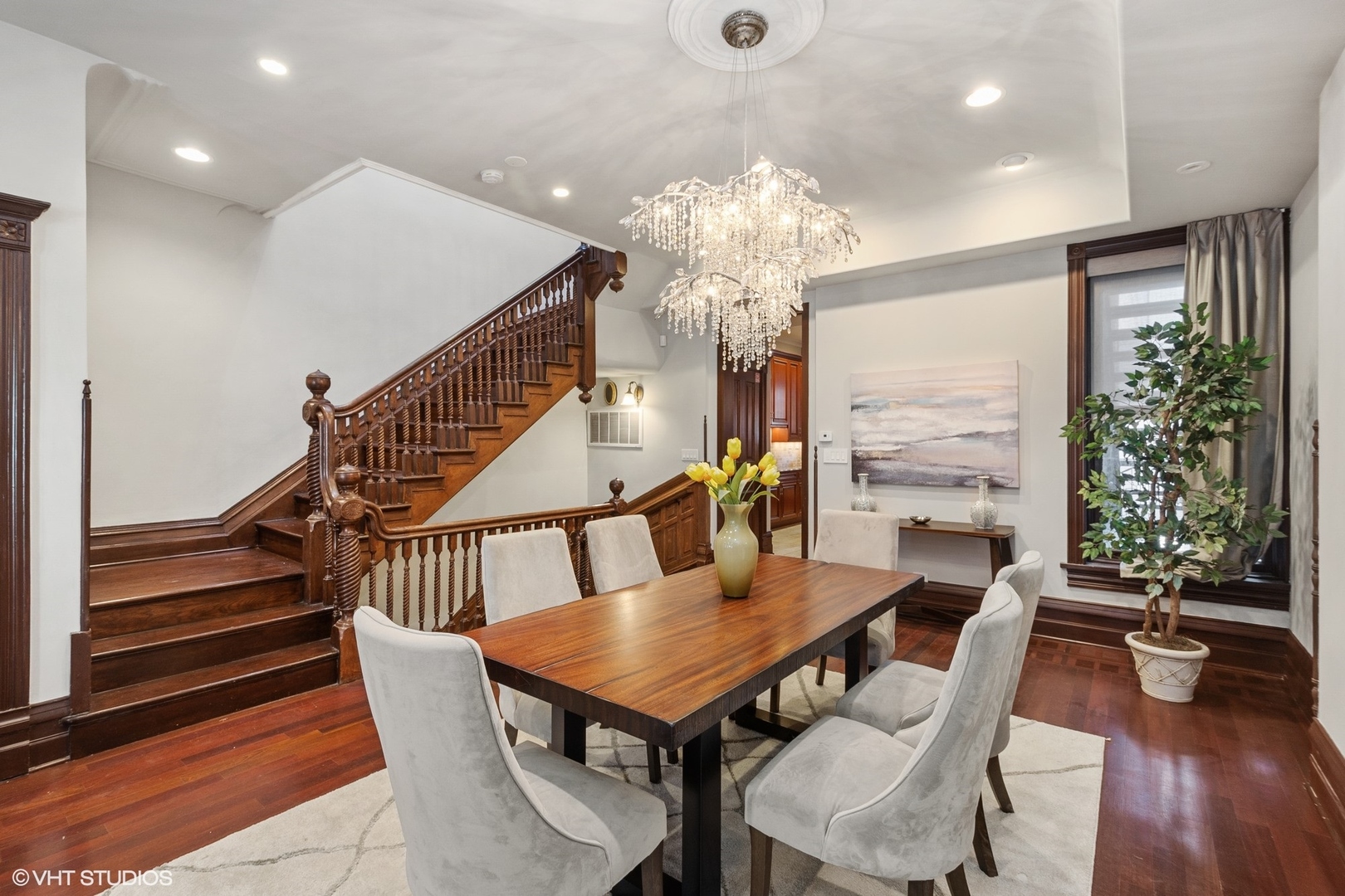 67 East Cedar Street Chicago, IL 60611 - Photo 14 of 37 a dining room with furniture a chandelier and wooden floor