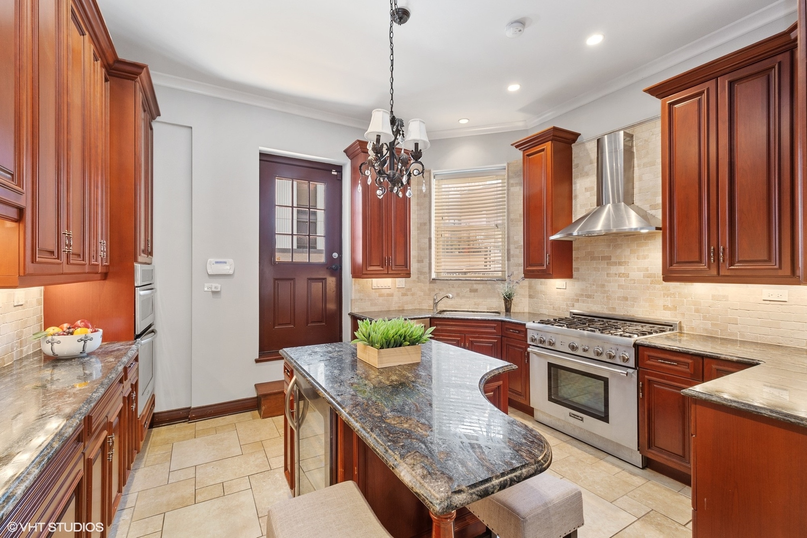 67 East Cedar Street Chicago, IL 60611 - Photo 15 of 37 a kitchen with granite countertop stainless steel appliances stove sink and cabinets