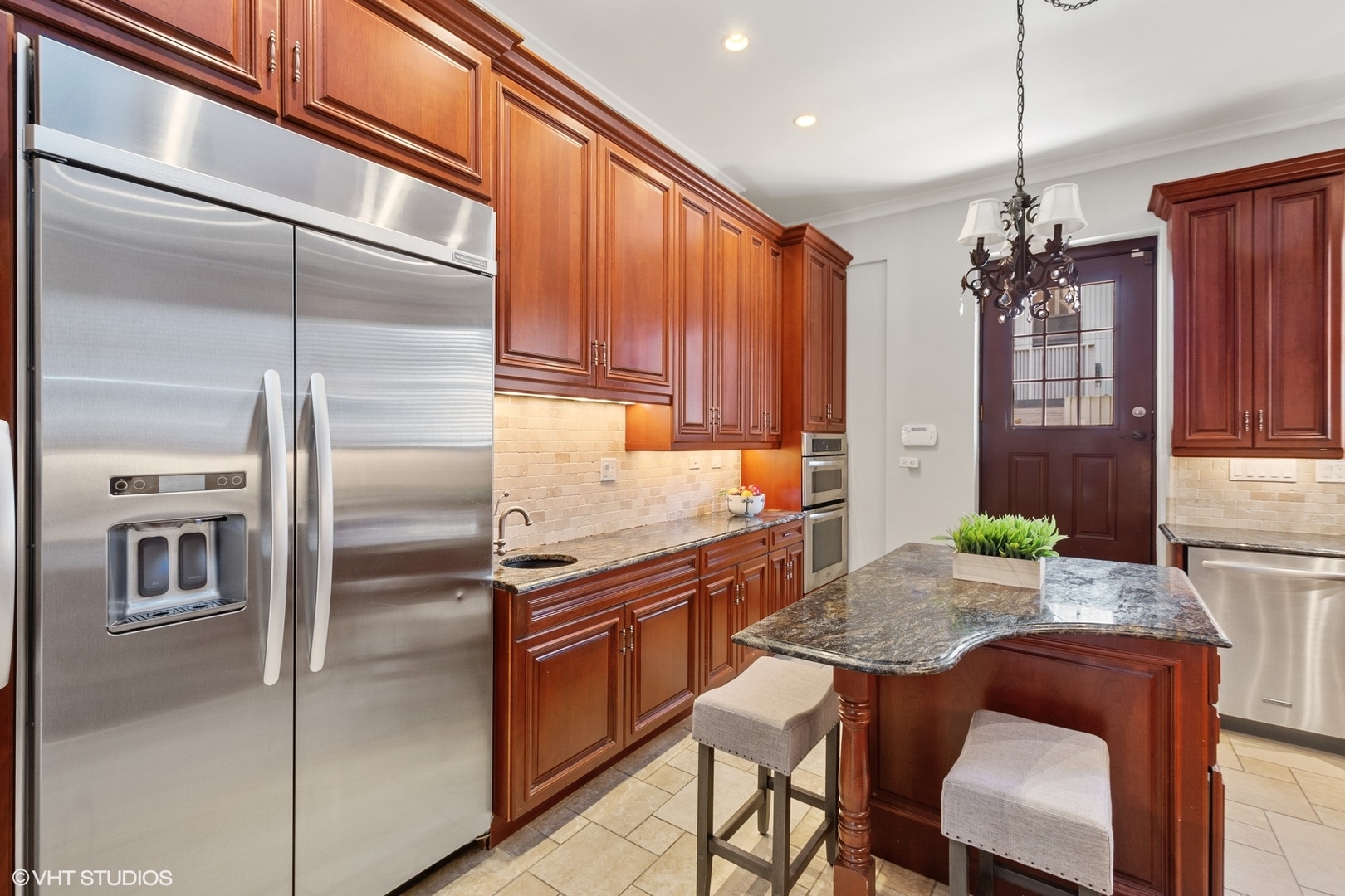 67 East Cedar Street Chicago, IL 60611 - Photo 16 of 37 a kitchen with granite countertop a refrigerator and a dining table