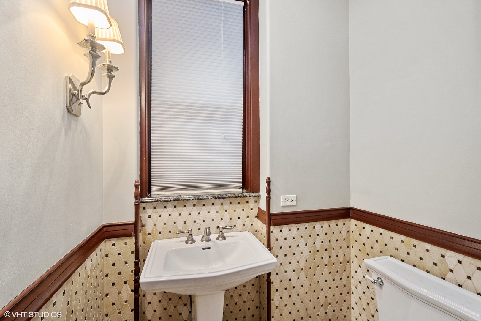 67 East Cedar Street Chicago, IL 60611 - Photo 19 of 37 a bathroom with a sink and a mirror