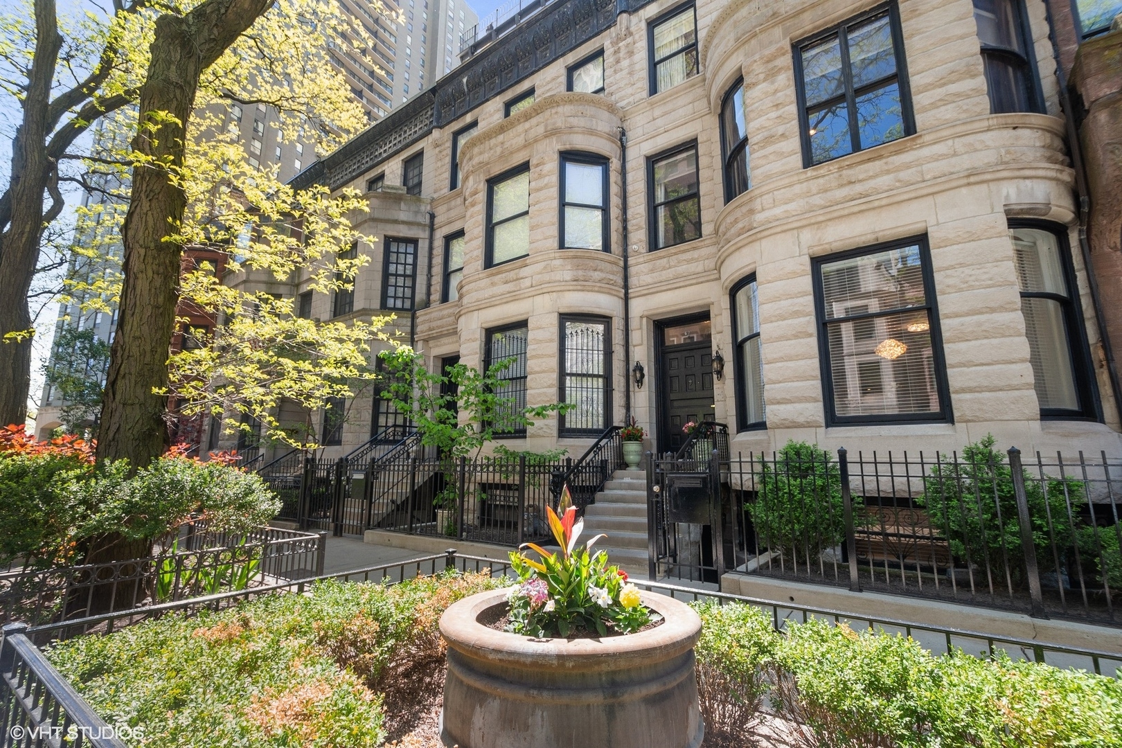 67 East Cedar Street Chicago, IL 60611 - Photo 2 of 37 a view of a house with a tub and flower pots
