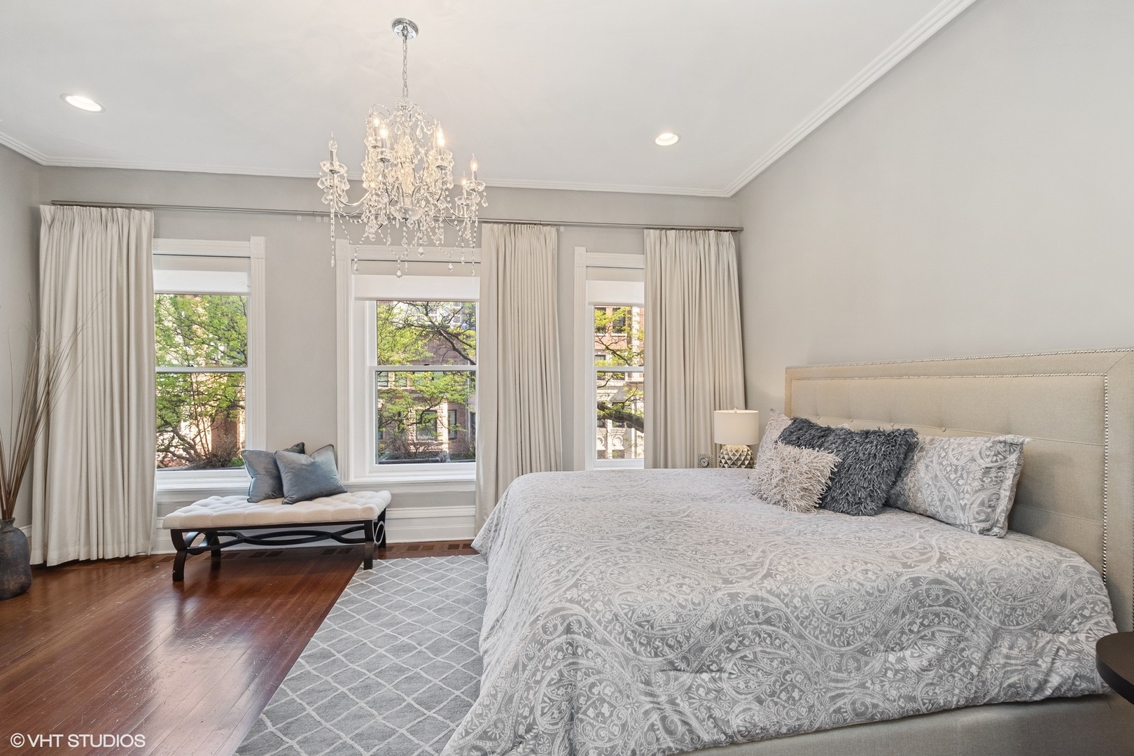 67 East Cedar Street Chicago, IL 60611 - Photo 21 of 37 a bedroom with a bed and a chandelier