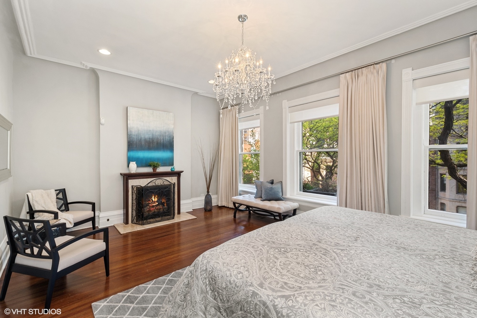 67 East Cedar Street Chicago, IL 60611 - Photo 22 of 37 a living room with furniture a fireplace and a chandelier