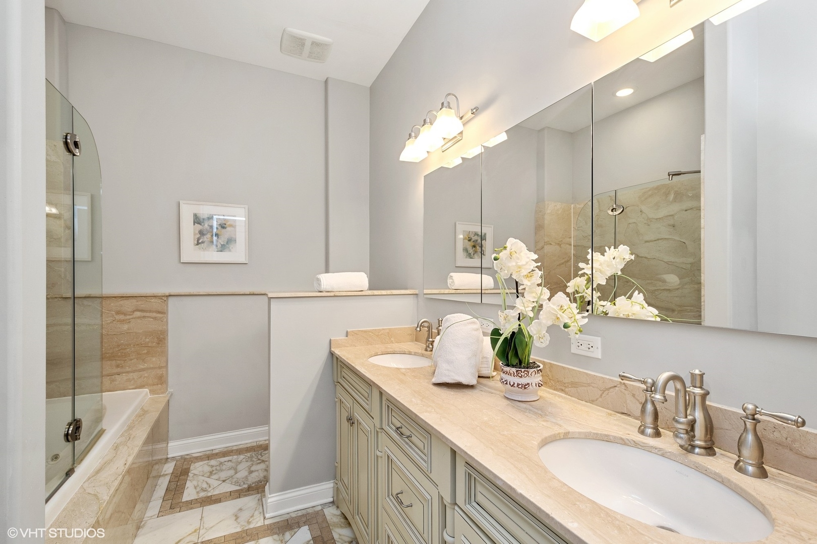 67 East Cedar Street Chicago, IL 60611 - Photo 24 of 37 a bathroom with a double vanity sink and a mirror