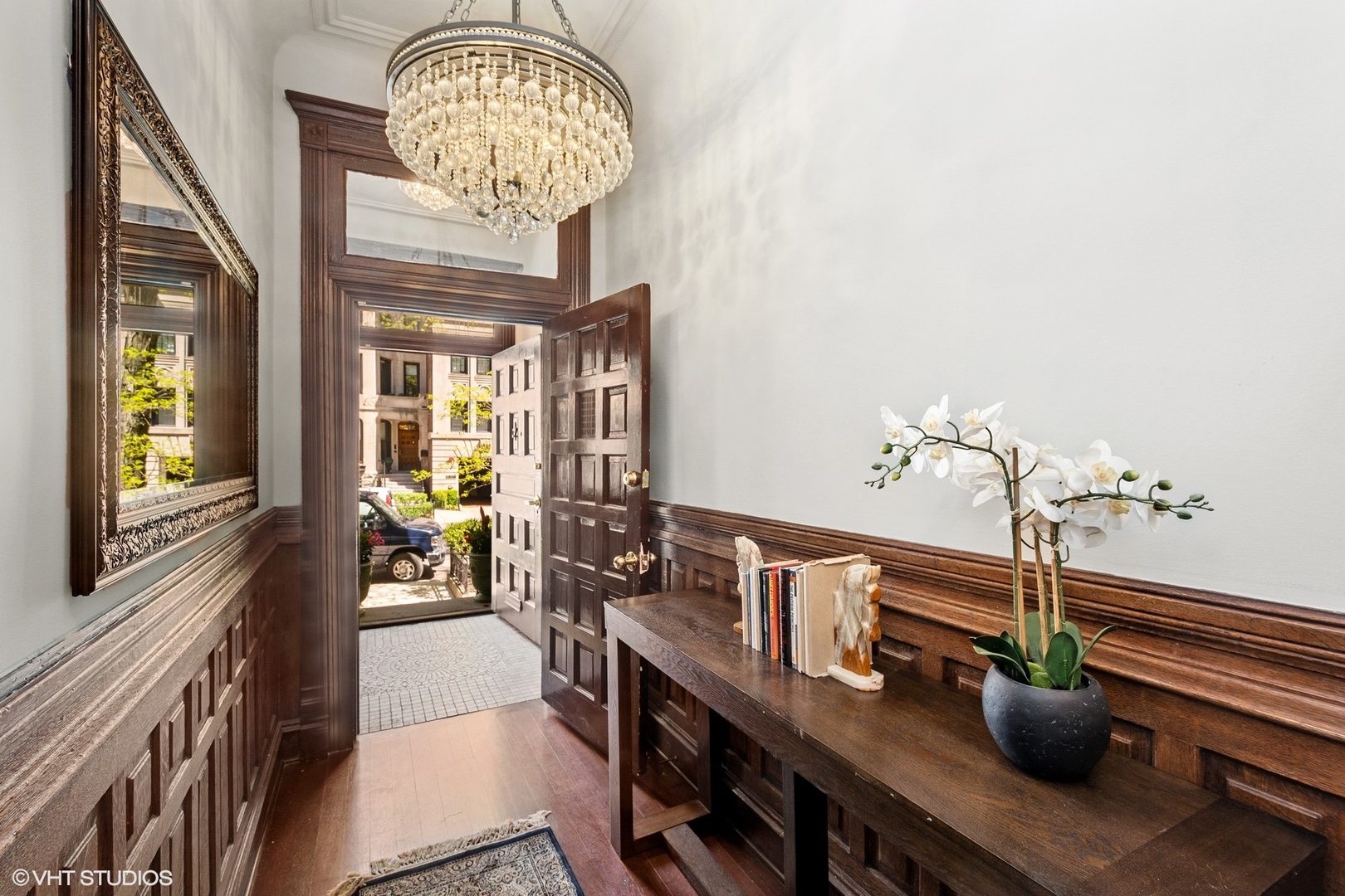 67 East Cedar Street Chicago, IL 60611 - Photo 4 of 37 a view of a dining room with furniture a chandelier and wooden floor