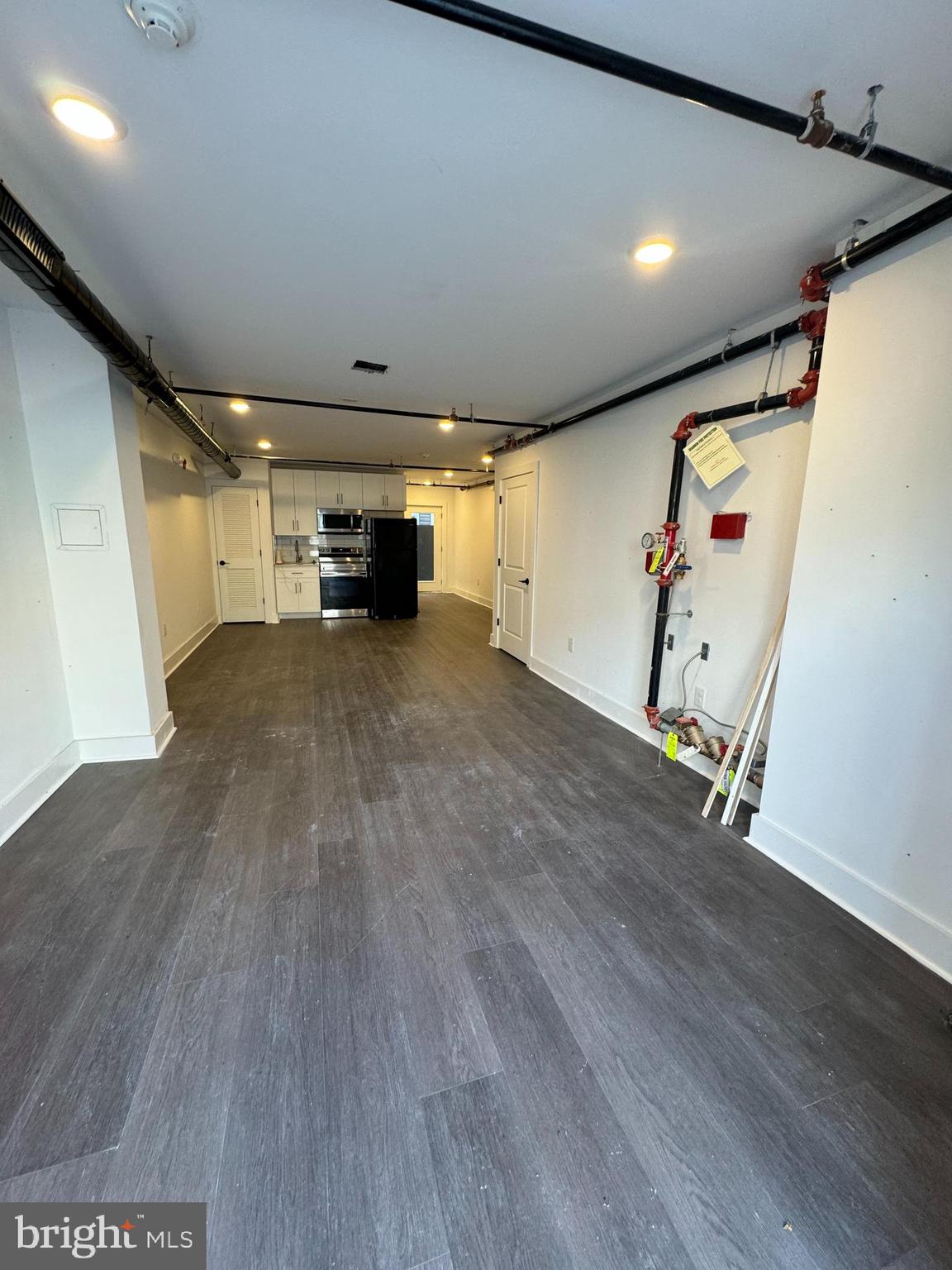 2331 East Thompson Street, Unit 1 Philadelphia, PA 19125 - Photo 2 of 6 an empty room with wooden floor