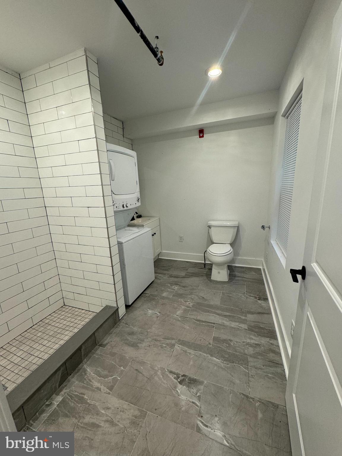 2331 East Thompson Street, Unit 1 Philadelphia, PA 19125 - Photo 5 of 6 a bathroom with a sink and a toilet