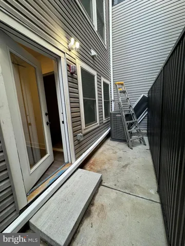 a view of backyard with furniture and a window