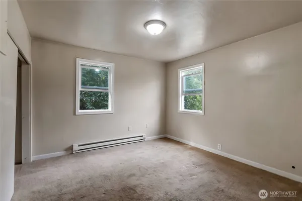 an empty room with windows