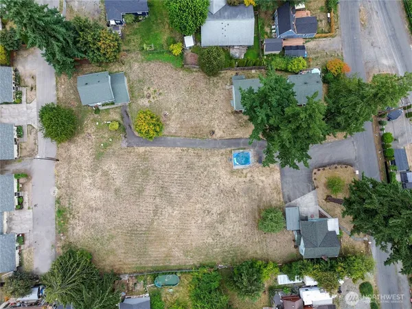 an aerial view of a house with outdoor space