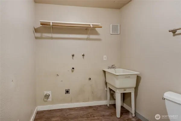 a bathroom with a toilet and sink