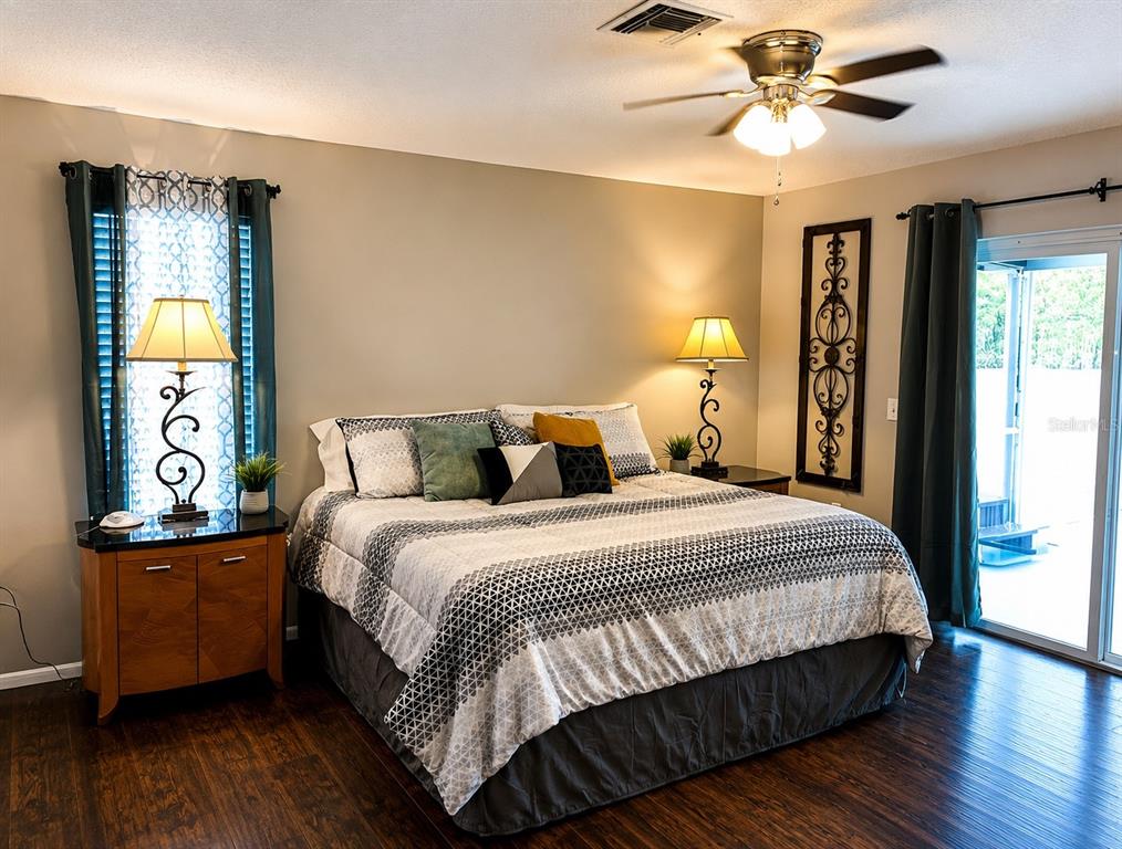 11177 Elgin Boulevard Spring Hill, FL 34608 - Photo 9 of 10 a bedroom with bed and window