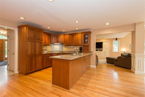 4 Farm Road Lexington, MA 02420 - Photo 11 of 28 a large kitchen with stainless steel appliances kitchen island granite countertop a large counter top stainless steel appliances and cabinets