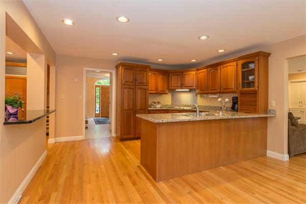 4 Farm Road Lexington, MA 02420 - Photo 12 of 28 a kitchen with stainless steel appliances granite countertop a refrigerator and a stove top oven