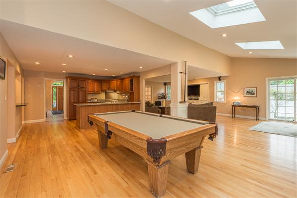 4 Farm Road Lexington, MA 02420 - Photo 13 of 28 a large kitchen with stainless steel appliances lots of counter space and wooden floor