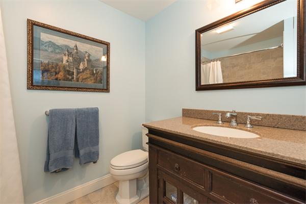 4 Farm Road Lexington, MA 02420 - Photo 21 of 28 a bathroom with a toilet a sink and mirror