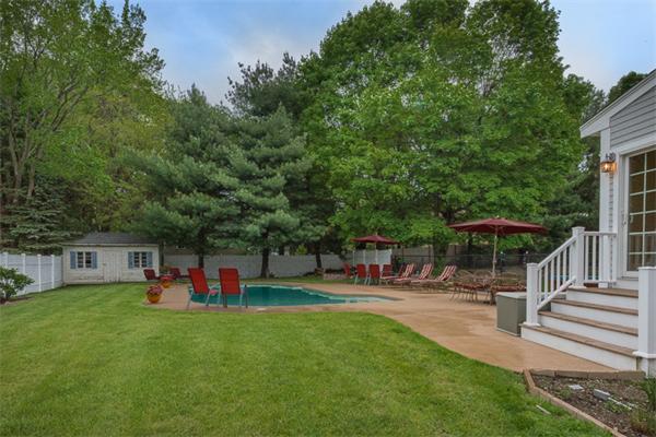 4 Farm Road Lexington, MA 02420 - Photo 24 of 28 a view of a backyard with sitting area and slide