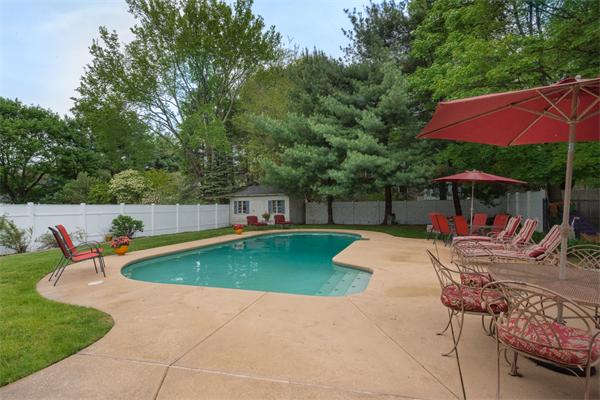 4 Farm Road Lexington, MA 02420 - Photo 28 of 28 a view of a swimming pool with a patio