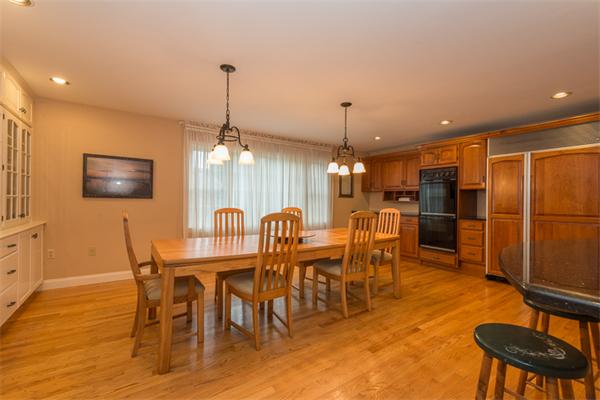 4 Farm Road Lexington, MA 02420 - Photo 6 of 28 a dining room with furniture a chandelier and wooden floor