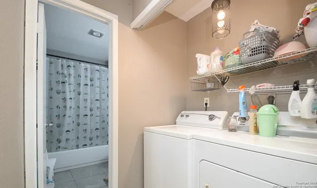 a bathroom with a sink a mirror and a shower