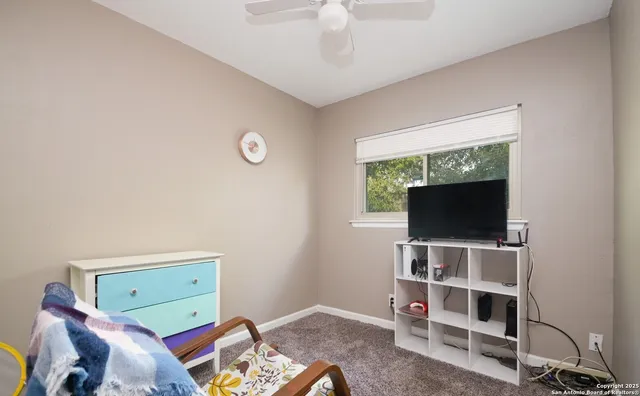 a view of a livingroom with furniture and a flat screen tv
