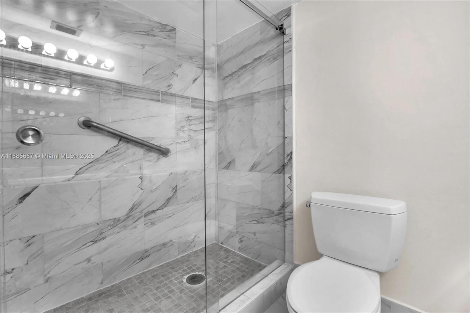 150 South Hollybrook Terrace, Unit 101 Pembroke Pines, FL 33025 - Photo 17 of 31 a bathroom with a toilet and a shower