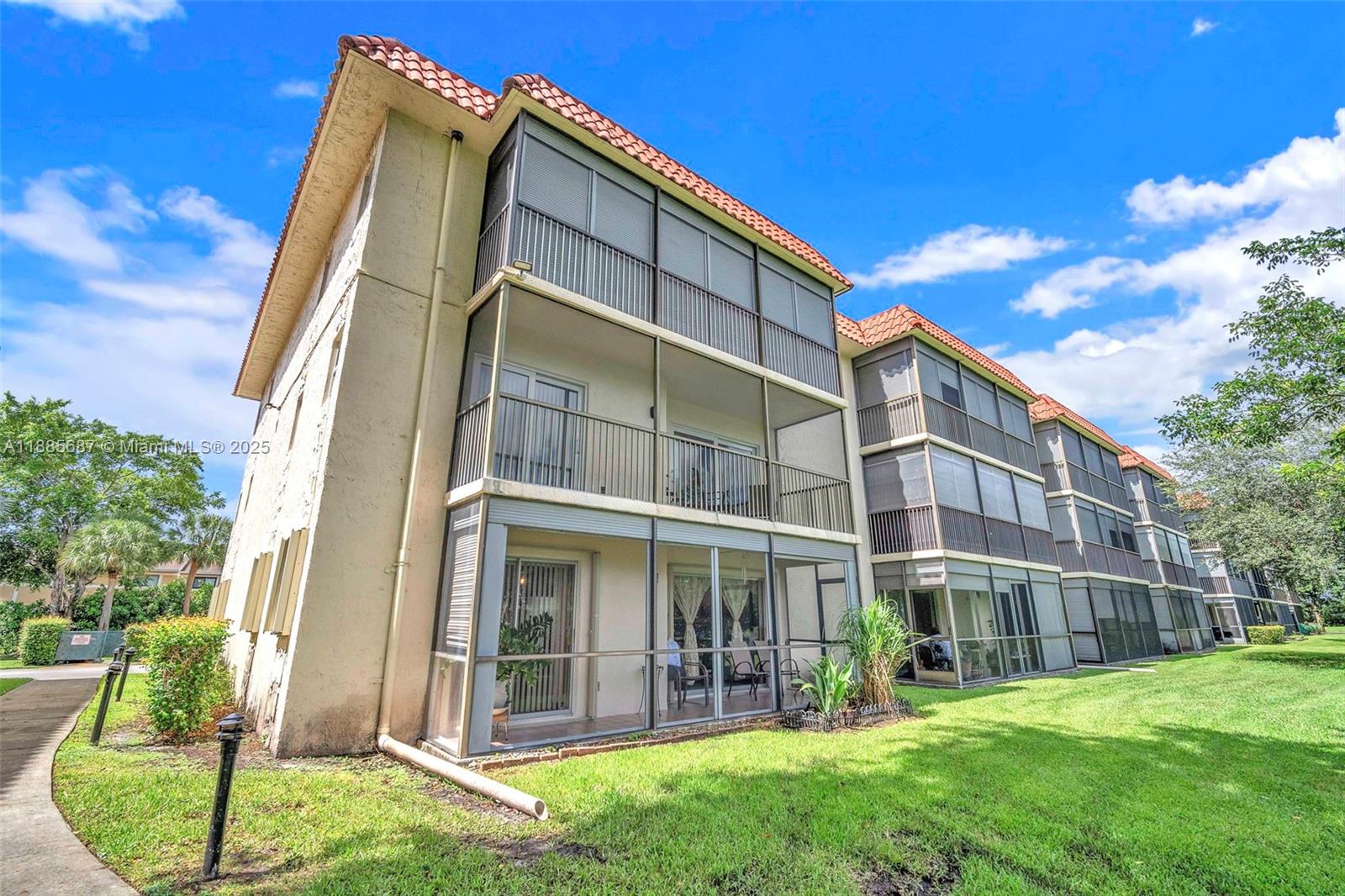 150 South Hollybrook Terrace, Unit 101 Pembroke Pines, FL 33025 - Photo 22 of 31 a view of a building with a yard