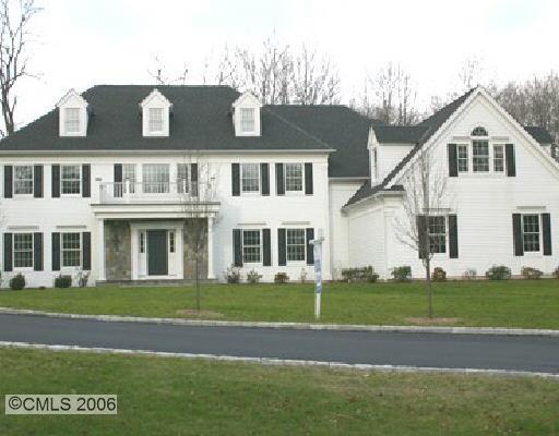 3-27 Golden Farm Road Stamford, CT 06903 - Photo 1 of 1 a front view of a house with a garden