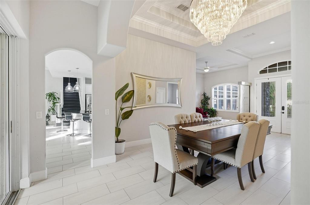 2914 Lee Shore Loop Orlando, FL 32820 - Photo 20 of 96 a view of a dining room with furniture and chandelier