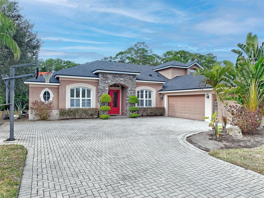 2914 Lee Shore Loop Orlando, FL 32820 - Photo 2 of 96 a front view of a house with garden