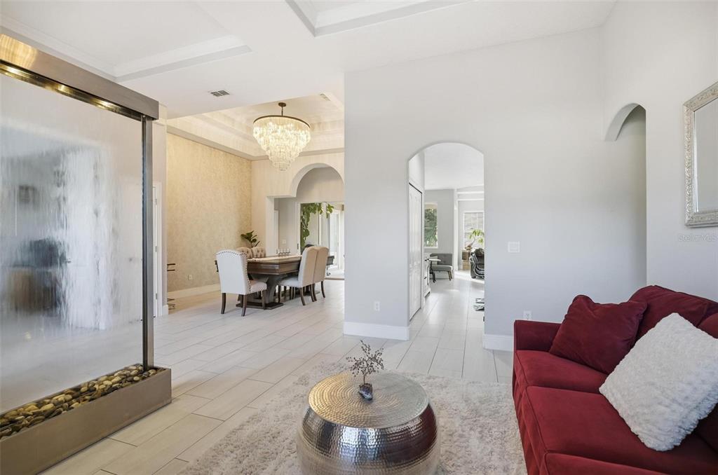 2914 Lee Shore Loop Orlando, FL 32820 - Photo 24 of 96 a living room with furniture and a chandelier